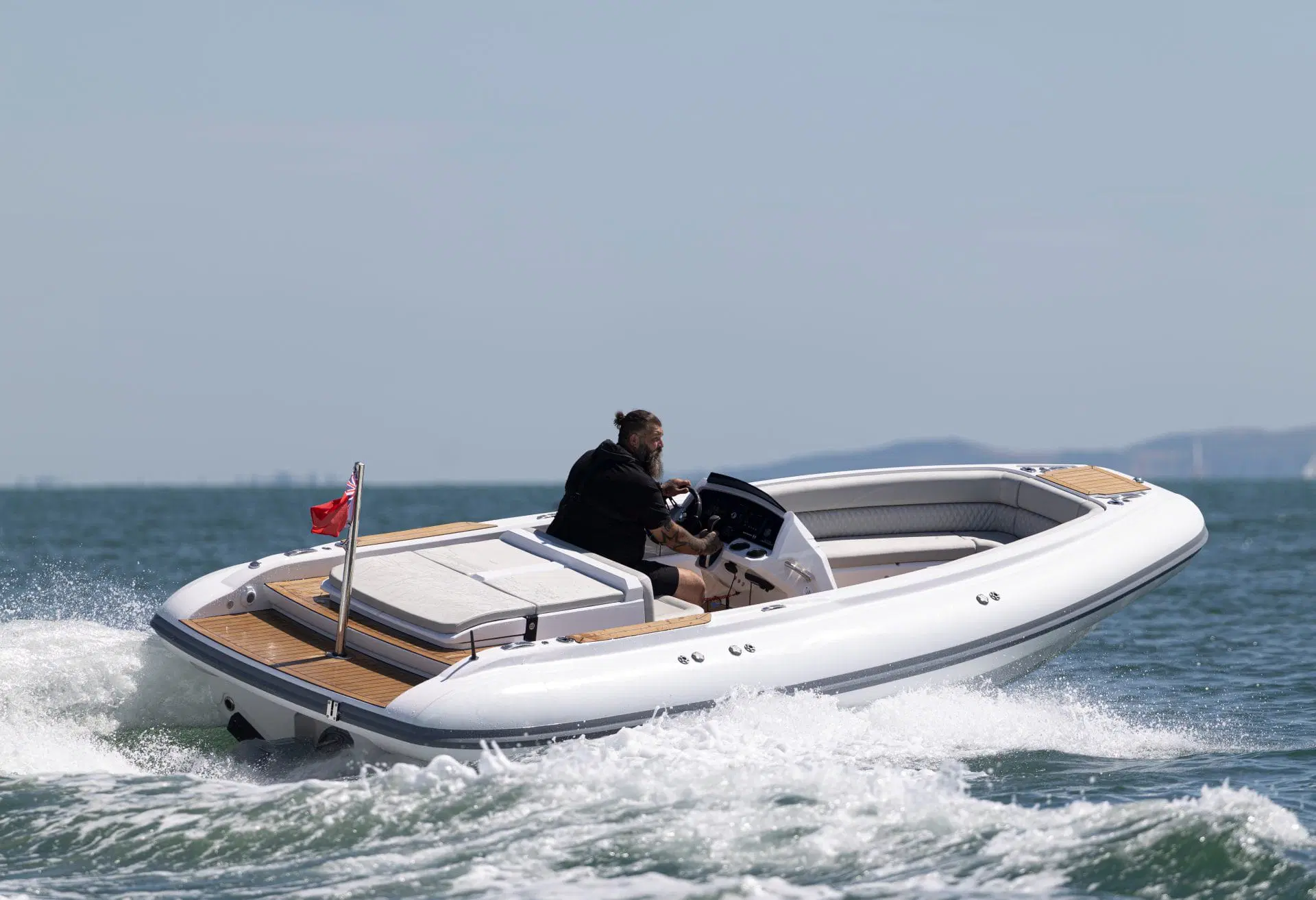 Whitmarsh ST 625 RIB running at speed, stern three-quarter view