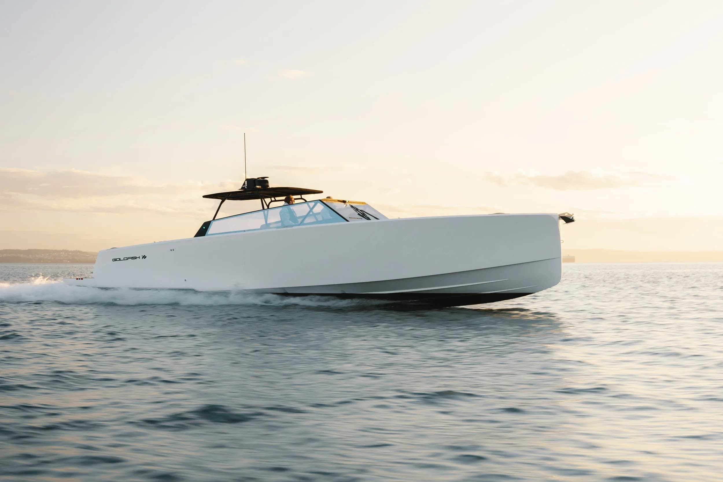 Goldfish 43 Ocean underway, exterior three-quarter bow view showing clean deck lines and minimalist profile