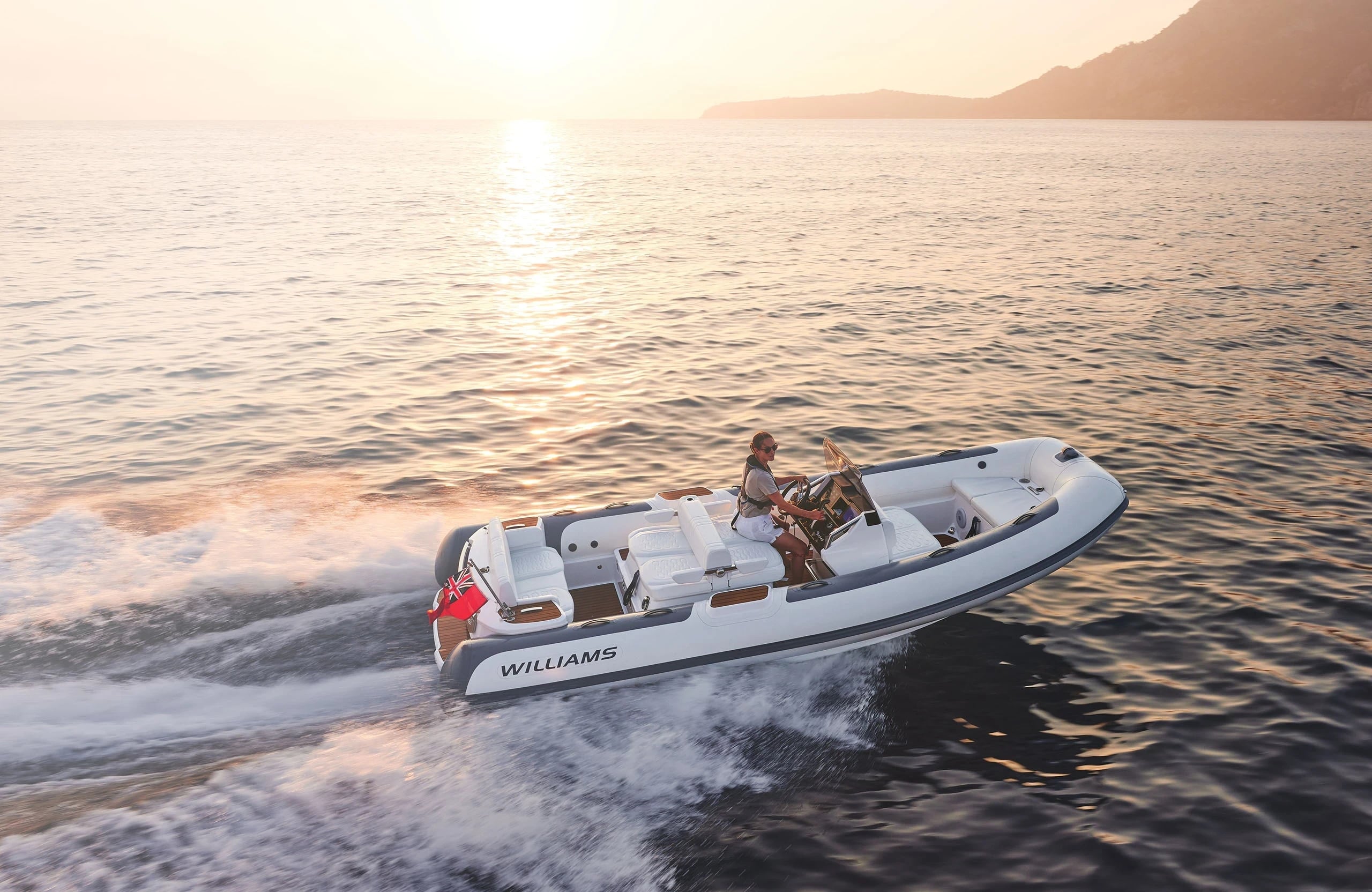 Williams DieselJet 565 product banner, three-quarter bow view underway